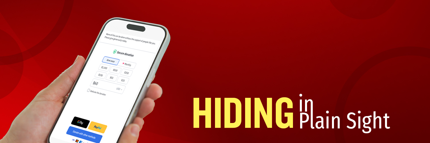 Hiding in plain sight. A hand holding aphone with a Fundraise Up donation page showing.